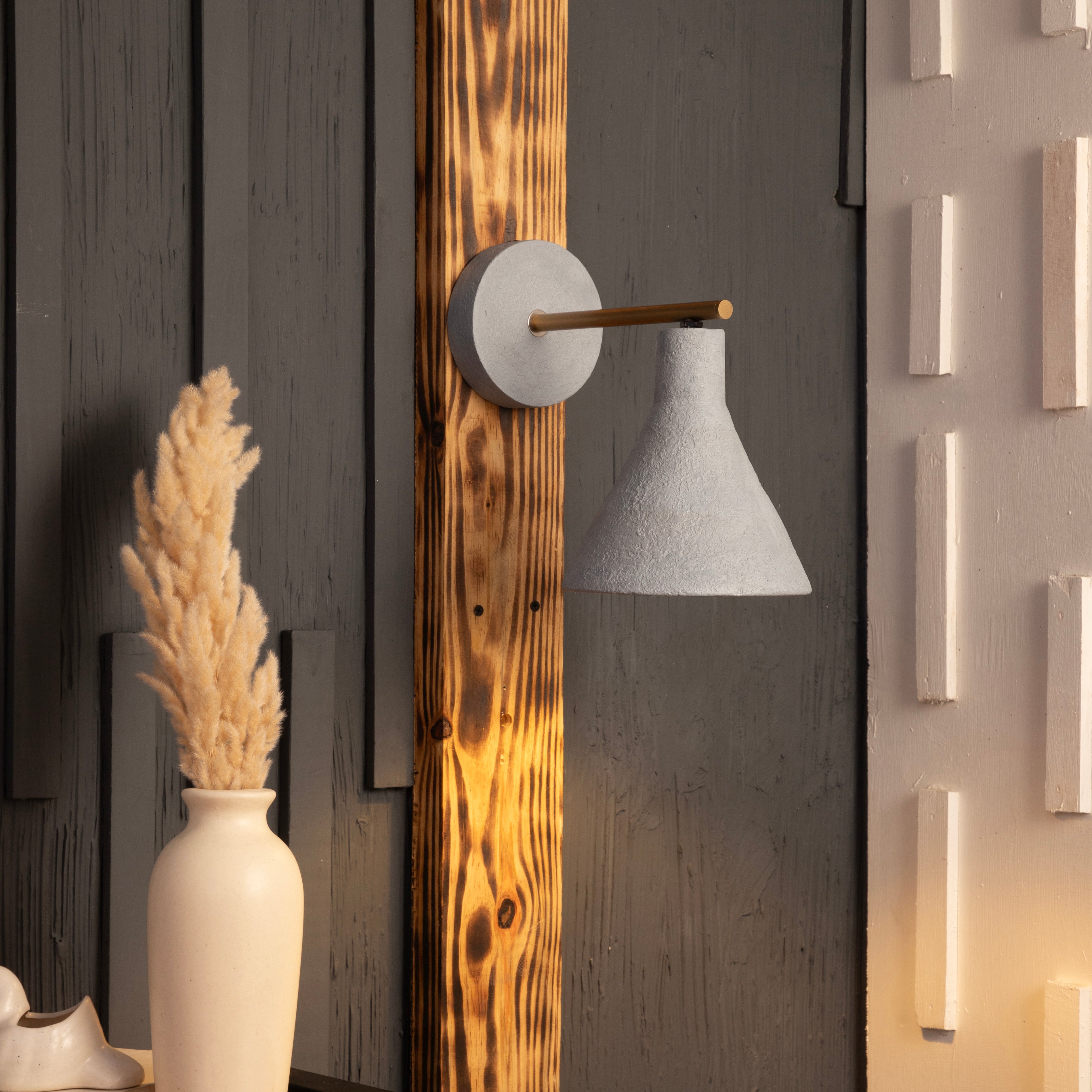 Concrete wall sconce by Shoppeefry